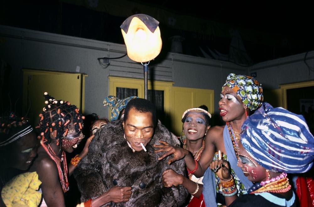 Fela Kuti surrounded by beautiful black women